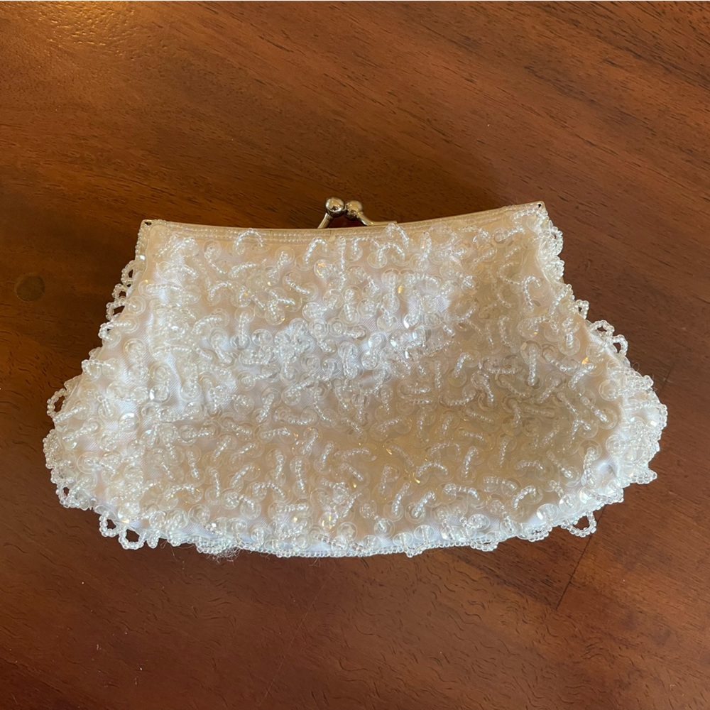 Caché white beaded clutch